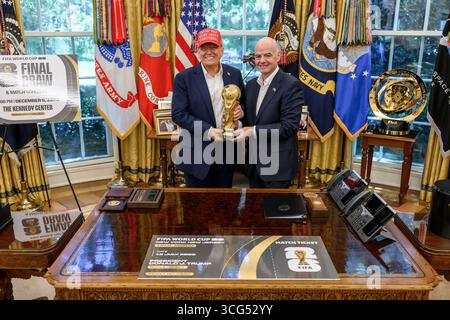 President Donald J. Trump with FIFA President Gianni Infantino at the Oval Office announcing the 2026 FIFA World Cup draw. Washington, D.C., August 2025. Image courtesy of the White House. Stock Photo