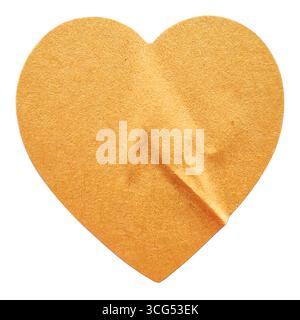 A Brown Heart-Shaped Sticker with a Lifted Corner, Isolated on a White Background Stock Photo