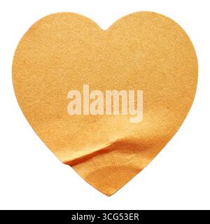 A Brown Heart-Shaped Sticker with a Lifted Corner, Isolated on a White Background Stock Photo