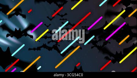 Flying bat silhouettes streaming across graphic night sky motif, with neon-colored diagonal streaks Stock Photo