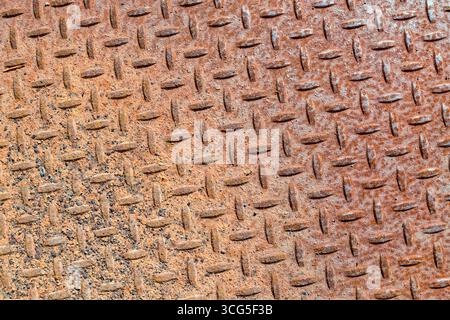 The detail of a rusty metal diamond plate floor surface Stock Photo