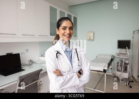 Positive young Indian medical specialist woman posing for portrait Stock Photo