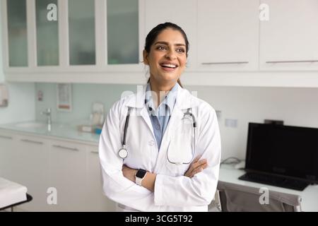 Happy confident young Indian medical professional woman posing for portrait Stock Photo