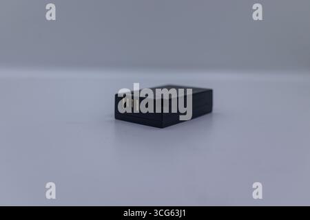 Close-up image of a battery charger isolated on a white background. Perfect for electronics, power accessories, tech equipment. Stock Photo