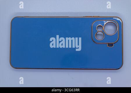 Blue smartphone back cover isolated on white background. Stock Photo