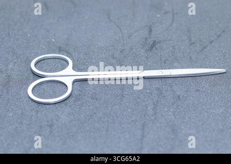Close-up of sharp stainless steel scissors with metallic silver blades and steel handles. Precision cutting tool ideal for sewing, crafting, office, o Stock Photo