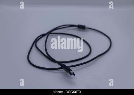 Modern USB-C cable or device compatible with smartphones, laptops, tablets, and other USB Type-C gadgets. Fast charging, data transfer, and universal Stock Photo