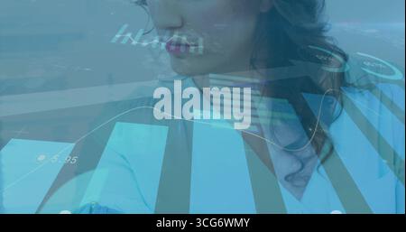 Presenting businesswoman wearing blue shirt analyzing financial data in office, translucent charts Stock Photo
