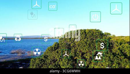 Displaying dense green shrub cluster along coastal shoreline, with green environmental icons Stock Photo