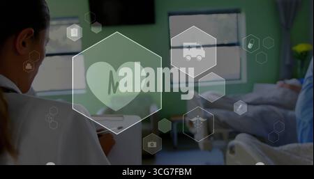 Reviewing doctor holding clipboard and checking digital medical icons in patient room, copy space Stock Photo