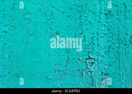 Blue cracked paint on wood vintage texture. Painted old wooden aquamarine wall background. Wooden grunge background Stock Photo