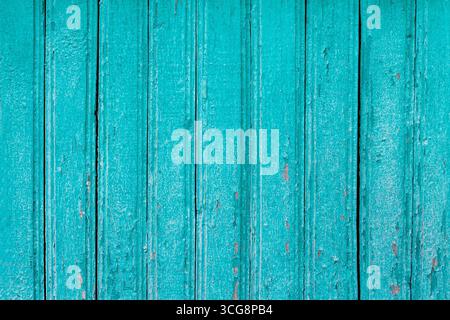 Blue cracked paint on wood vintage texture. Painted old wooden aquamarine wall background. Wooden boards grunge background Stock Photo