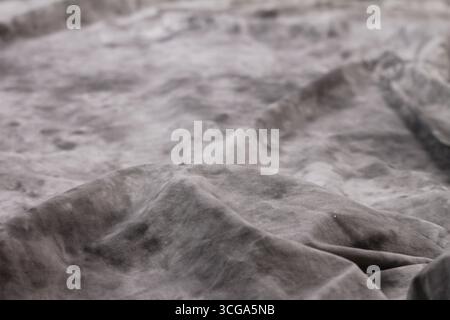 Overlay of layers of gray fabric. Abstract texture background. Stock Photo