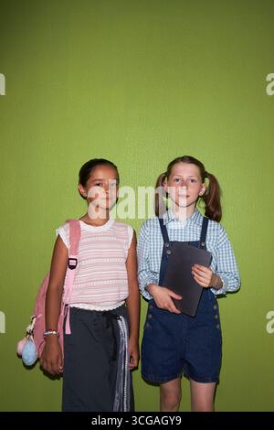Portrait of two elementary school girls smiling in library Stock Photo ...