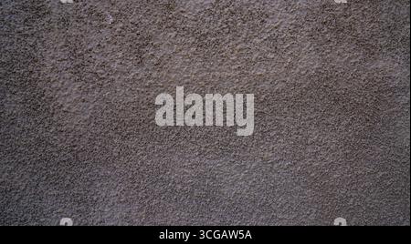 Closeup of rough gray plaster wall with stucco texture, perfect neutral background for design Stock Photo