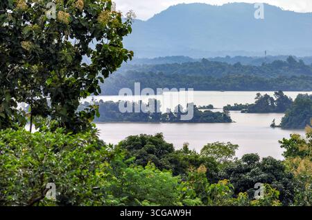 Morning mist over Kaptai Lake with dramatic green hill views.this photo was taken from Rangamati,Chittagong Bangladesh. Stock Photo