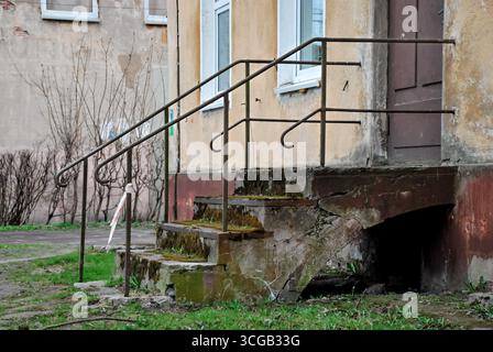 Rauschen, Russia - May 02, 2013 - Weathered concrete staircase with rusted railings outside an abandoned building. Stock Photo