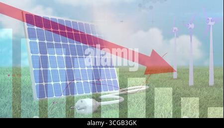 Displaying tilted solar panel in meadow featuring red downward arrow, charts and wind turbines Stock Photo