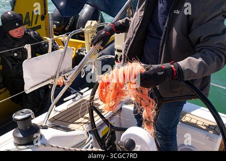 A frayed nylon rope recovered from a boat's propeller Stock Photo