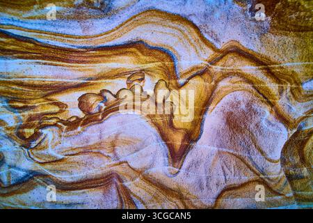 Abstract Sandstone Layers Texture with Swirling Earth Tones Close Up Stock Photo