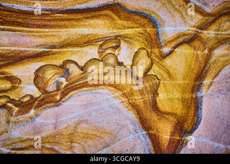 Abstract Golden Sand Texture with Blue and White Streaks Close Up Stock Photo