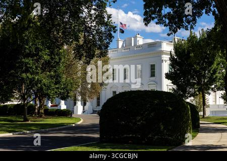 Washington, USA. 27th Aug, 2025. The U.S. flag flies at half-staff at the White House in Washington, DC, the United States, Aug. 27, 2025. A shooting occurred Wednesday morning at Annunciation Catholic School in the city of Minneapolis, the U.S. state of Minnesota, killing an 8-year-old and a 10-year-old and injuring 17 others, police confirmed. Hours after the shooting, U.S. President Donald Trump signed a proclamation lowering the flags to half-staff in honor of the victims. Credit: Hu Yousong/Xinhua/Alamy Live News Stock Photo