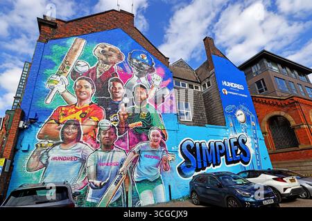 Large-scale mural in Manchester celebrating The Hundred and the city’s team, Manchester Originals, featuring male and female players together Stock Photo
