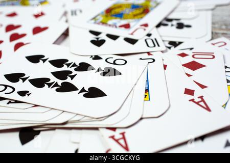 A closeup view of a pile of random playing cards. Stock Photo