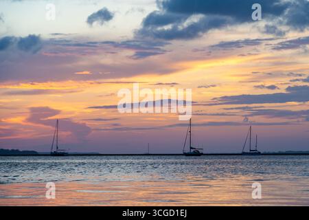 Colorful sunset view of the Amelia River (Intracoastal Waterway) from the Fernandina Harbor Marina in Fernandina Beach on Amelia Island in Florida. Stock Photo