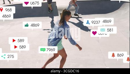 Female skater wearing denim jacket leading friends through skatepark bowl, with notification icons Stock Photo