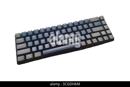 A modern, compact black mechanical keyboard with dark keycaps, ideal for a clean workspace, gaming setup, or professional typing. Isolated on a pure w Stock Photo