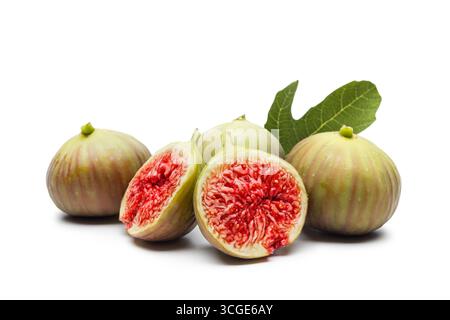 Fresh ripe figs whole and sliced on white background. Stock Photo