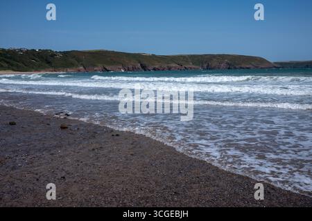 Tidal Waves and Rocks on the beach Freshwater East in Pembrokeshire West Wales UK Stock Photo