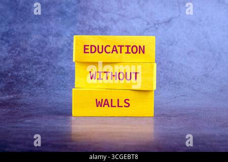 Copy space; Concept words EDUCATION WITHOUT WALLS on wooden blocks on a bright background. Stock Photo