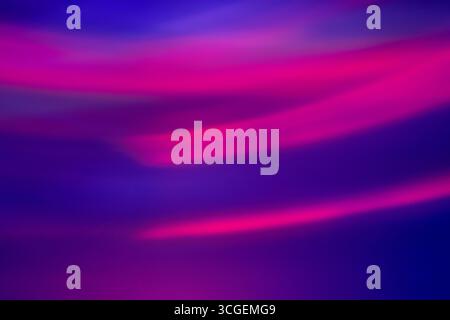 Abstract long exposure light painting with a smooth gradient of blue and magenta. A concept for technology, speed, energy, and modern futuristic desig Stock Photo