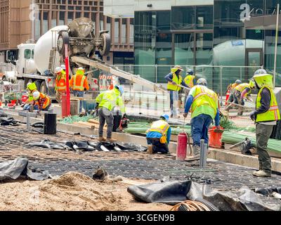Denver, Colorado, USA - 4 June 2025: Construction workers preparing reinforced foundations for concrete for a new road in the the city centre Stock Photo