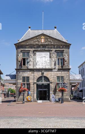 The historic Waag (Weigh House) in Gouda, a classical Dutch building with ornate carvings and a prominent facade, on a sunny day. Gouda, Netherlands, Stock Photo