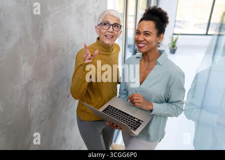 Business people with laptop, innovation in research and programming for future app technology Stock Photo