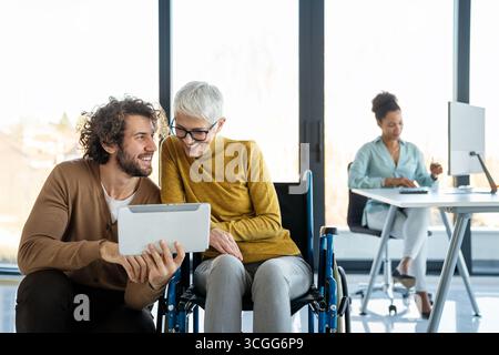 Programmers cooperating at IT company developing apps. People business work office concept Stock Photo