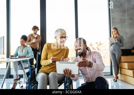 Programmers cooperating at IT company developing apps. People business work office concept Stock Photo