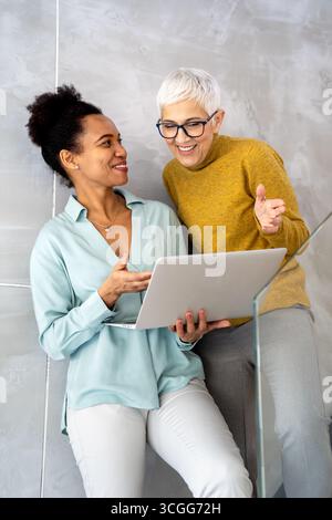 Business people with laptop, innovation in research and programming for future app technology Stock Photo