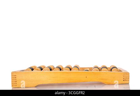 A calculator, which is a mechanical computing device for performing arithmetic operations, isolated on a white background, close-up. Stock Photo