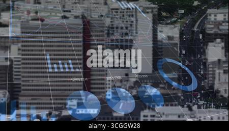 Grid overlay floating over high-rise skyline and roadway, showing line graph, bar and pie charts Stock Photo