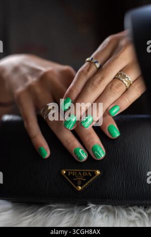 Female hand with green nail design holding nail polish bottle Stock Photo - Alamy Female hand with green nail design holding nail polish bottle Stock Photo - Alamy