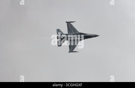 A fighter jet flying in a cloudy sky, showcasing sleek design and advanced aerodynamics in an airborne display at RIAT 2025 Stock Photo