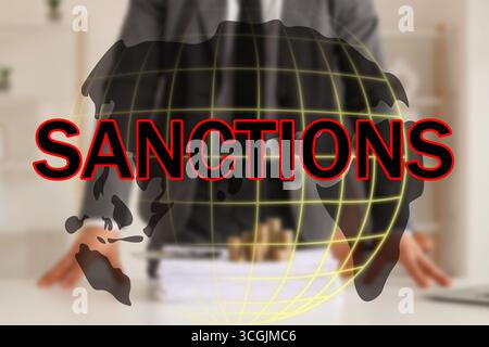 Triple exposure of businessman, word SANCTIONS and planet Earth on virtual screen Stock Photo