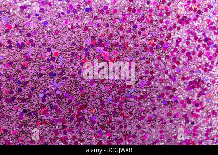 Full frame macro abstract texture background of sparkling multicolor pink glitter surface with copy space Stock Photo