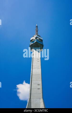 Avala Tower standing tall against blue sky in Belgrade, Serbia Stock Photo