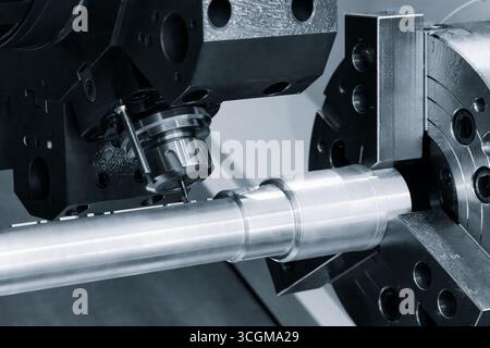 Metal machine tools industry. CNC turning machine high-speed cutting is operation. Stock Photo