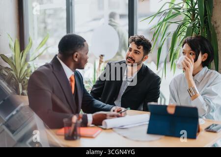 Business people having a productive meeting in a rustic co working cafe environment Stock Photo